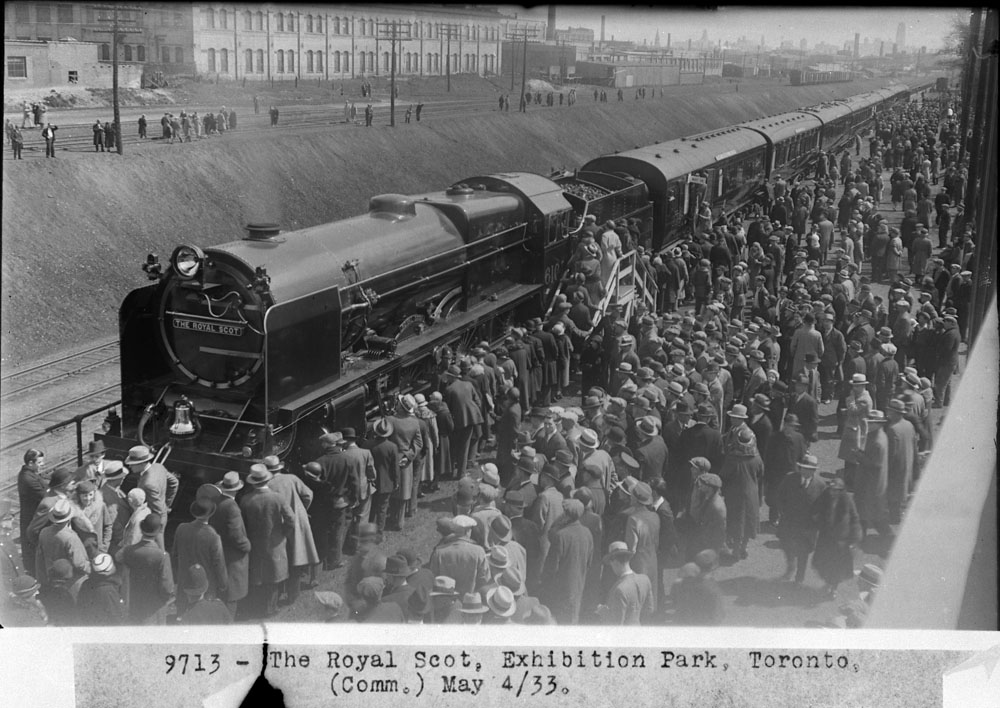 May 3, 1933: Over 10,000 Torontonians line up at the Exhibition Grounds railway display track to view the interior of the "Royal Scot." The London Midland &amp; Scottish train consisted of 4-6-0 No. 6100 and eight cars, normally used between London and Glasgow or Edinburgh. 1/3