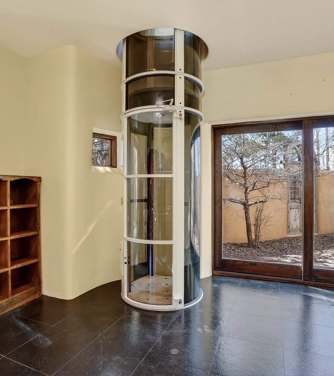 Thepixiepaige's tweet photo. @zillowgonewild Elevator is giving pneumatic mail tube vibes! https://t.co/Wuxwfyy9xM
