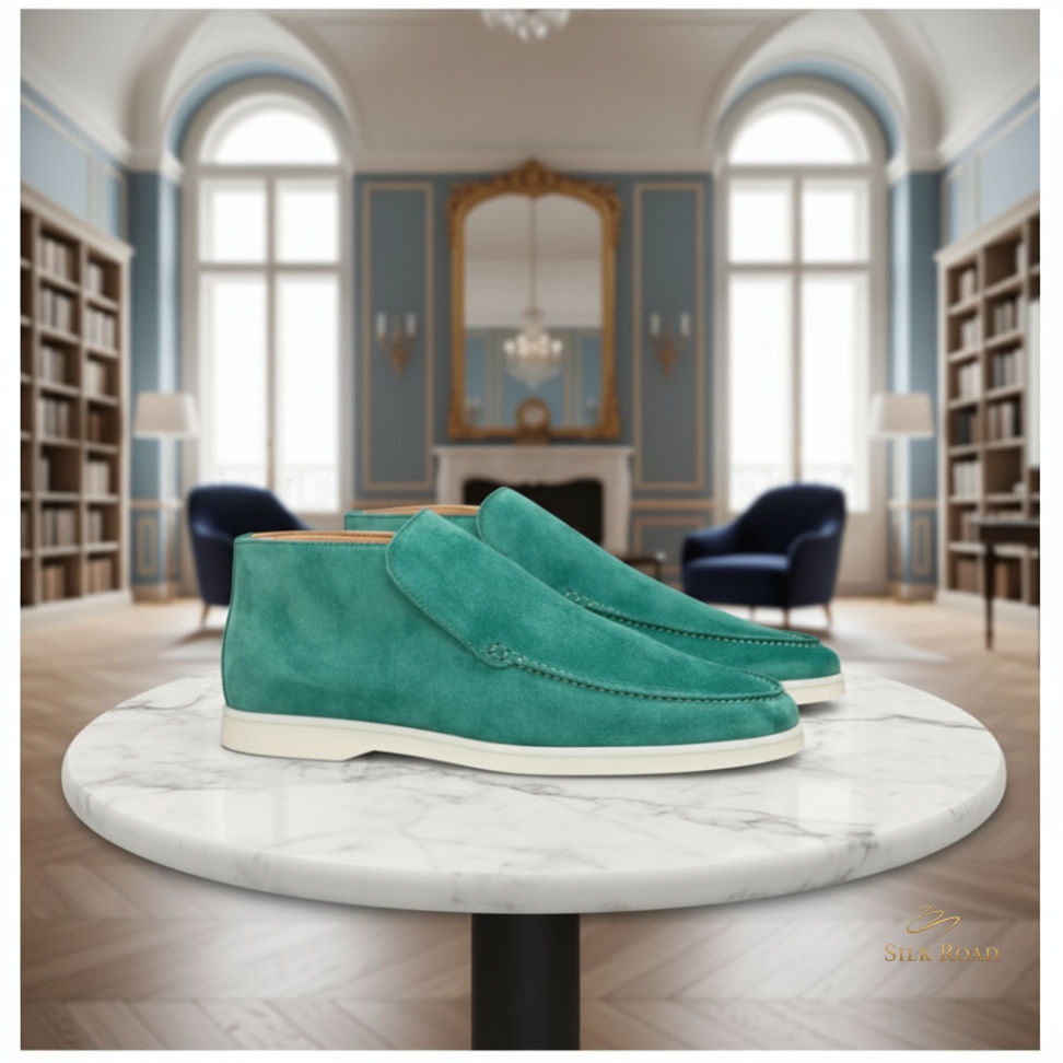 silkroadcache's tweet image. The scent of aged parchment meets the saturated hue of deep teal suede. A quiet presence in a room full of history, these Teal Suede Loafers ground every move in purposeful craft. Shop the look → silkroadcache.com #SilkRoad #MensStyle #LuxuryFootwear #SuedeLoafers