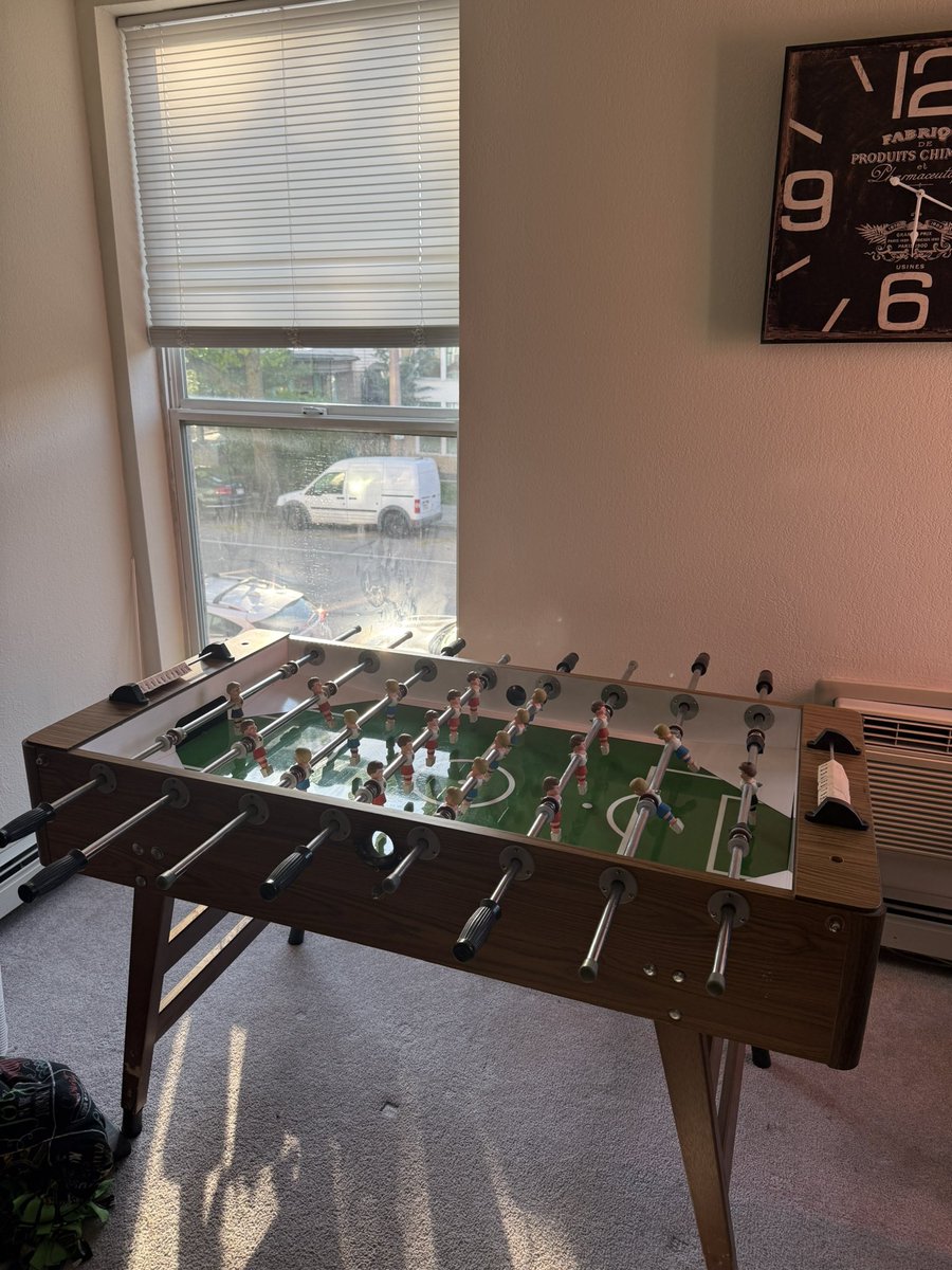 Why have a dining table, when you can just have a foosball table instead?