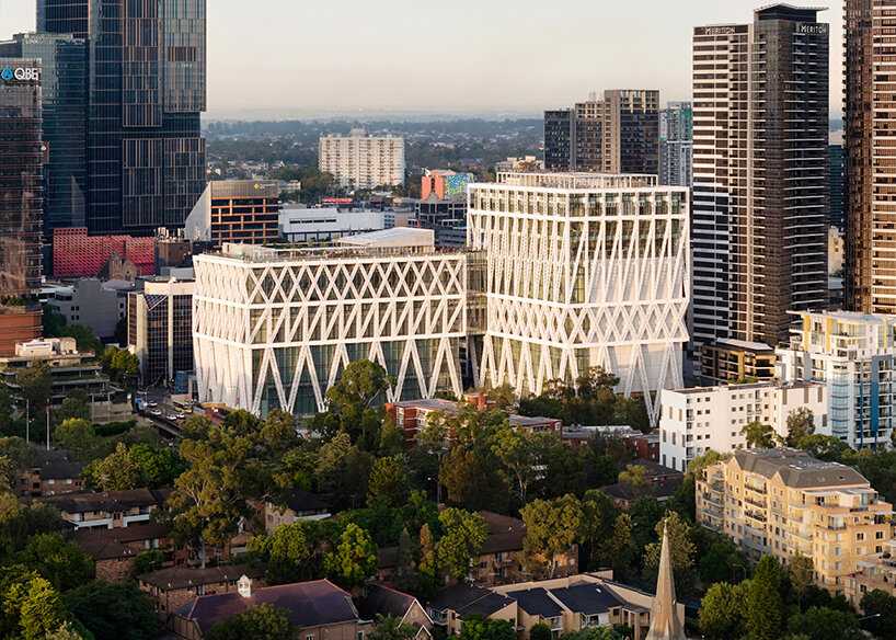 The Powerhouse Parramatta designed by Moreau Kusunoki and Genton features a distinctive steel exoskeleton that provides structural support and sun-shading for column free galleries. The net-zero emissions riverfront cultural hub is scheduled to open in late 2026.