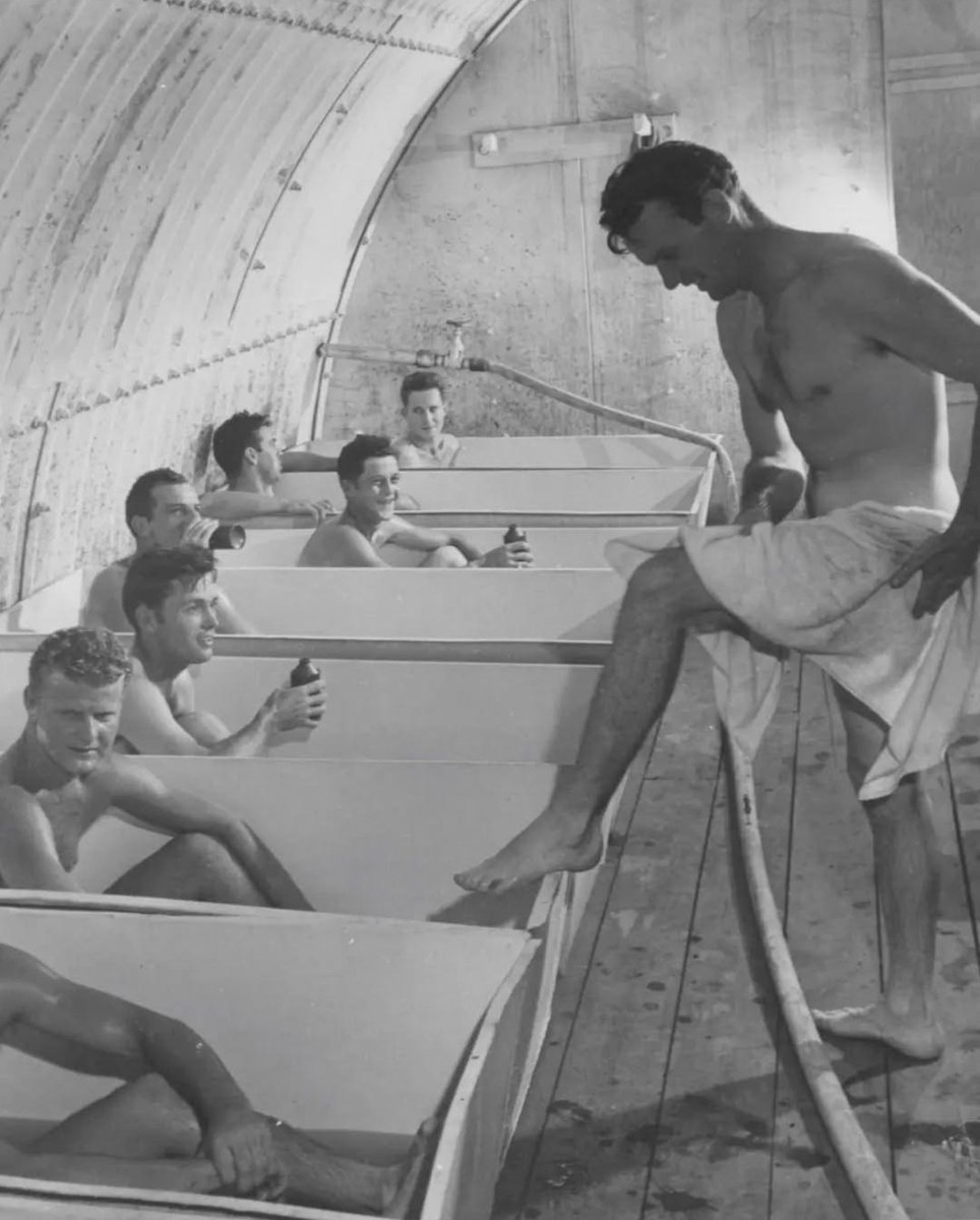 ThatOtherJJ's tweet photo. ᴠ ɪ ɴ ᴛ ᴀ ɢ ᴇ

In this striking World War II photo, U.S. Navy sailors take a moment of respite in portable bathtubs at Naval Base Hospital No. 20 on Peleliu, August 1945.

After intense combat, these men seize the chance to clean up and unwind in a makeshift bathing station. Similar mobile units served British troops in Burma and elsewhere, offering frontline fighters a simple but vital touch of comfort amid the hardships of war.