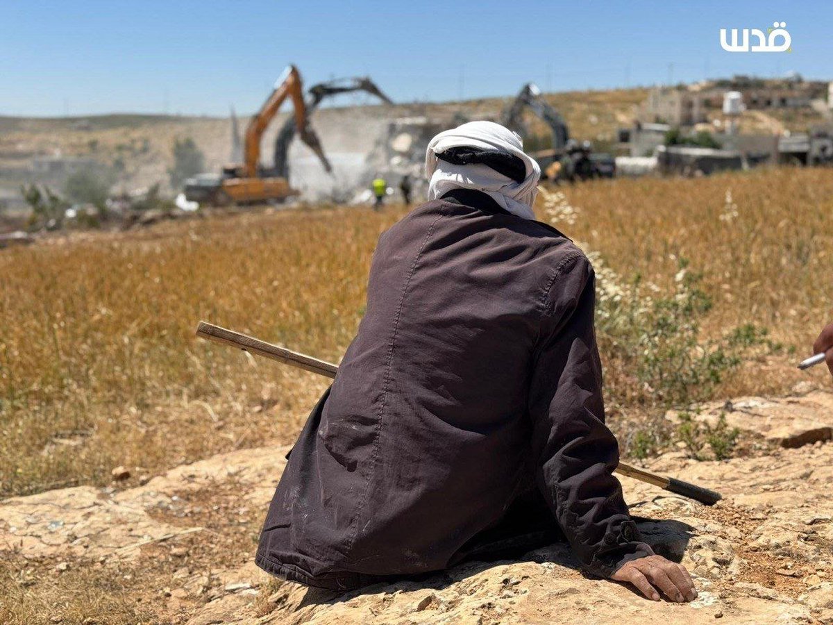 QudsNen's tweet image. Palestinians watch in grief as Israeli bulldozers demolish their home in the village of Ad-Deirat, south of Hebron, in the occupied West Bank.
