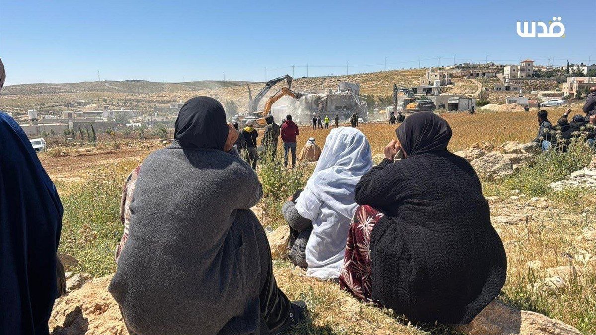 QudsNen's tweet image. Palestinians watch in grief as Israeli bulldozers demolish their home in the village of Ad-Deirat, south of Hebron, in the occupied West Bank.