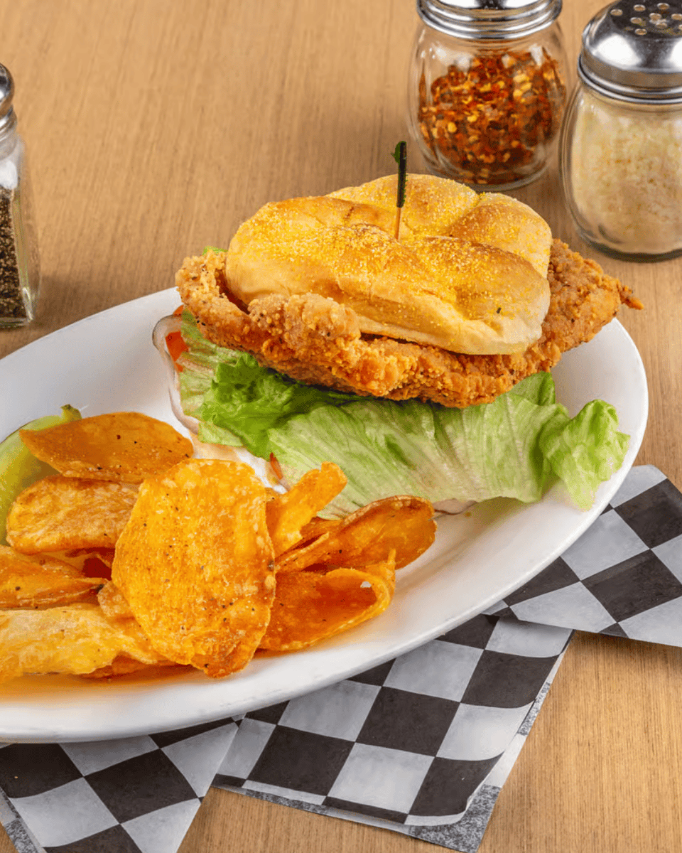 Gaslight_Pizza's tweet photo. Hand-cut, breaded or grilled, and served on a toasted bun. That's how we do tenderloin at The Gaslight. It's been a grill favorite for years. Come grab one with your favorite side and a cold beer from the bar. https://t.co/Vvw10SA9HL https://t.co/8MWKTVhis7