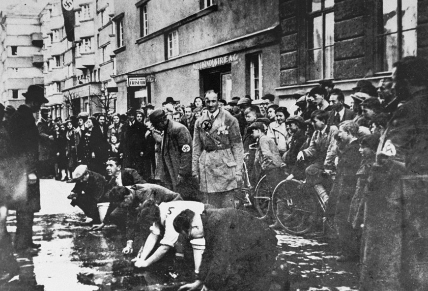 In the terrifying days after the 1938 Anschluss, 19-year-old Rudolf Stern was ripped from his family’s shop in Vienna. 

A man wearing a swastika armband thrust a bucket and scrubbing brush into his hands and forced him to his knees on Hagenmüllergasse.
For two agonizing hours,
