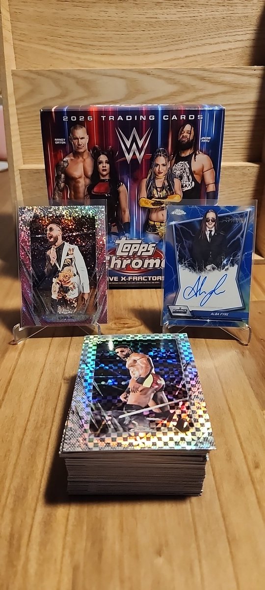 cavemanfire's tweet photo. Just opened a mega box of wwe topps chrome and I was happy with the results. I struck out on pulling liv or roman for the buyback program but I'll always take an auto and numbered card @CardPurchaser https://t.co/teauPuMJ7i