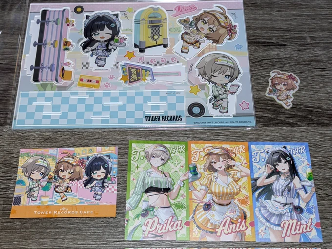 NIKKEのタワレココラボカフェ行ってきました～! アニス、ミント、プリカの装飾で飾られた店内もコラボメニューも最高だった!メニュー頼んだ後にガラポンでランダムで貰えるカードも3人コンプ出来て満足すぎる結果でした! #NIKKE