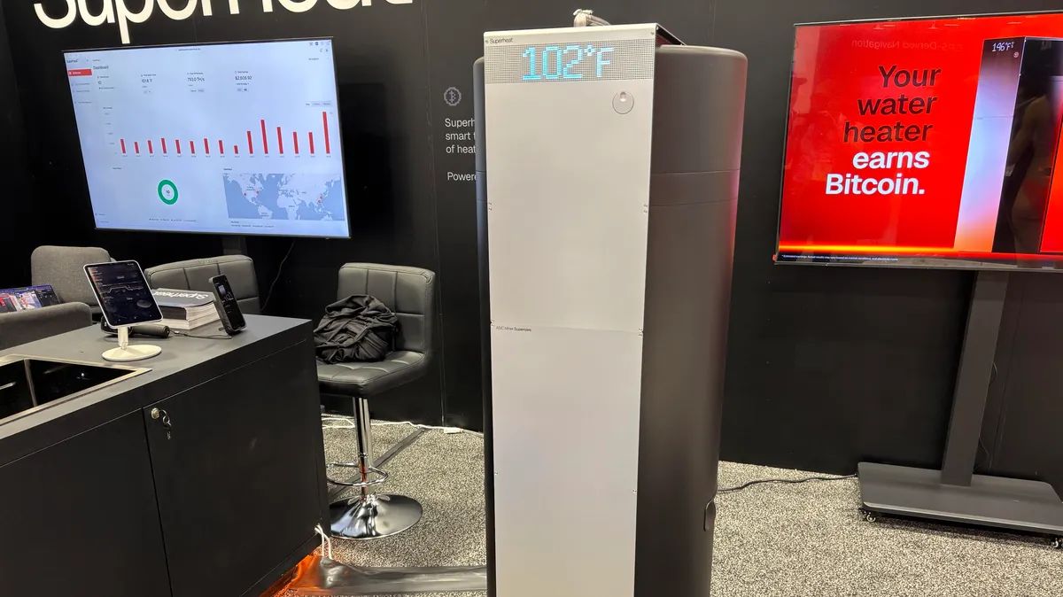 Bitcoin_Teddy's tweet photo. Bitcoin miner/water heater featured on the CES 2026 show floor 

- Built with ASIC Bitcoin miners mounted on a 50-gallon water heater. 
- Same energy usage as a standard electric water heater while producing BTC
- Mining revenue could fully offset water-heating expenses https://t.co/XeDRUOHnQw