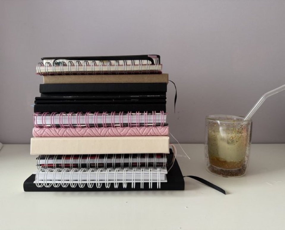 lilyychloe's tweet photo. just a girl and her notebooks https://t.co/5RxfRMGrpo