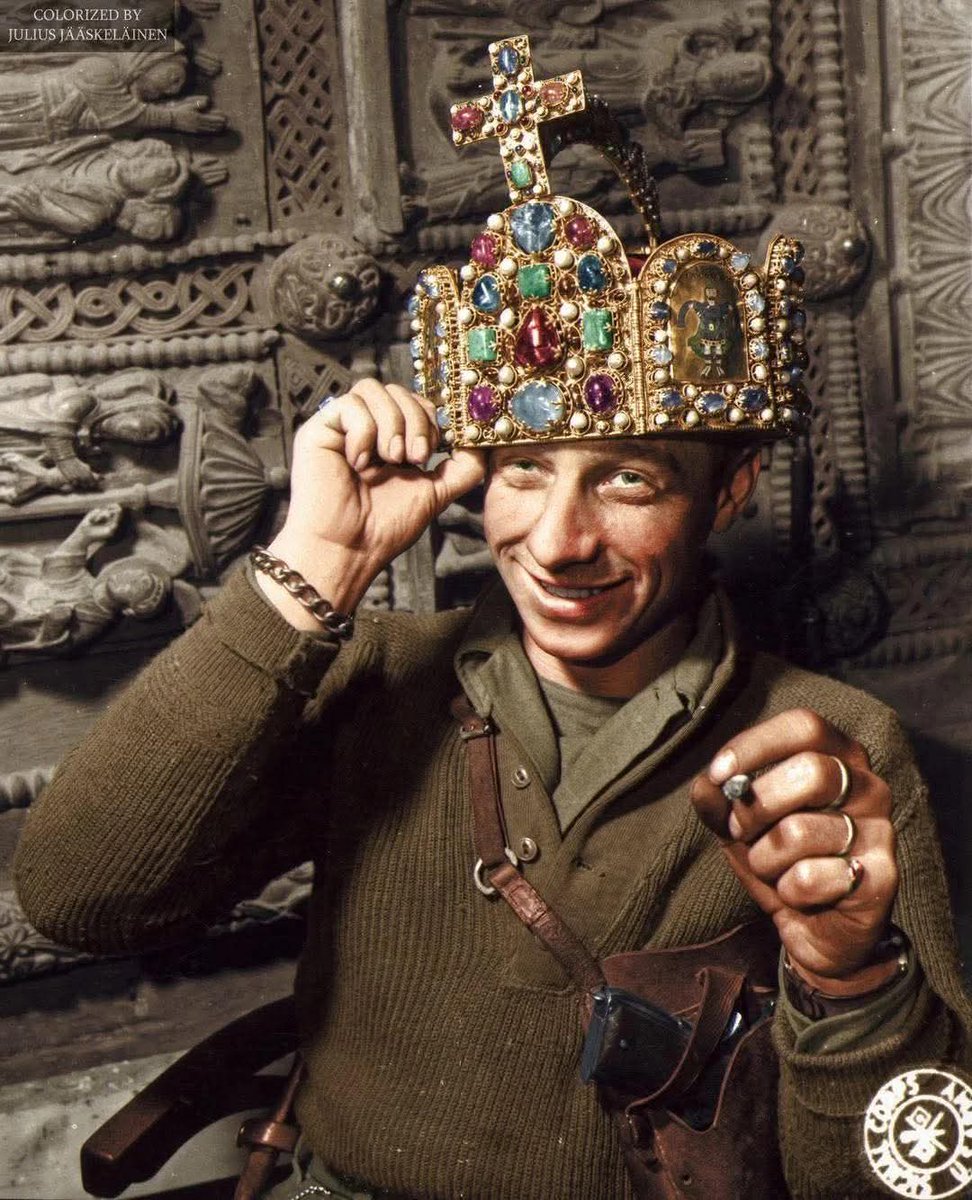An iconic 1945 photo shows American soldier Ivan Babcock jokingly wearing the Crown of the Holy Roman Empire... 

Private First Class Ivan Babcock (29 at the time), a member of the Army's 165th Signal Photo Company. The photo was taken inside a mine in Siegen, Germany, which the