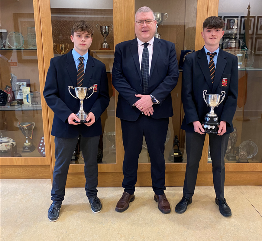 Senior Captain Kevin Walsh and Junior Captain Ryan Finucane, presenting their Munster B Hockey Cups to their Principal, Mr. Tom Prendergast on their historic double title win, two cups in one week! Well done to all players and coaches.