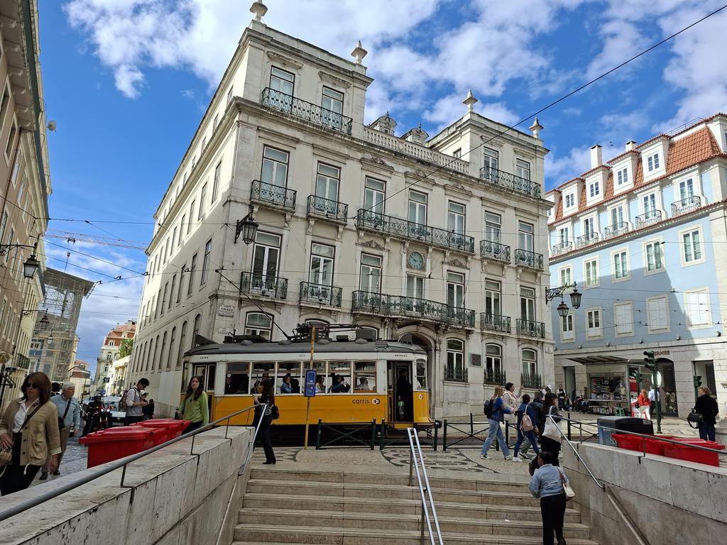kamfinsa's tweet photo. As I've mentioned, I like my refreshment with a view. Here, #Lisbon's priciest cappuccino (6 euros, worse than Dublin) on the rather tone-y Largo do Chiado, with the iconic #28 tram and Hermes boutique as backdrop. Still struggling to get my bearings in this vast city. #Chiado https://t.co/6dT2kWyrbo