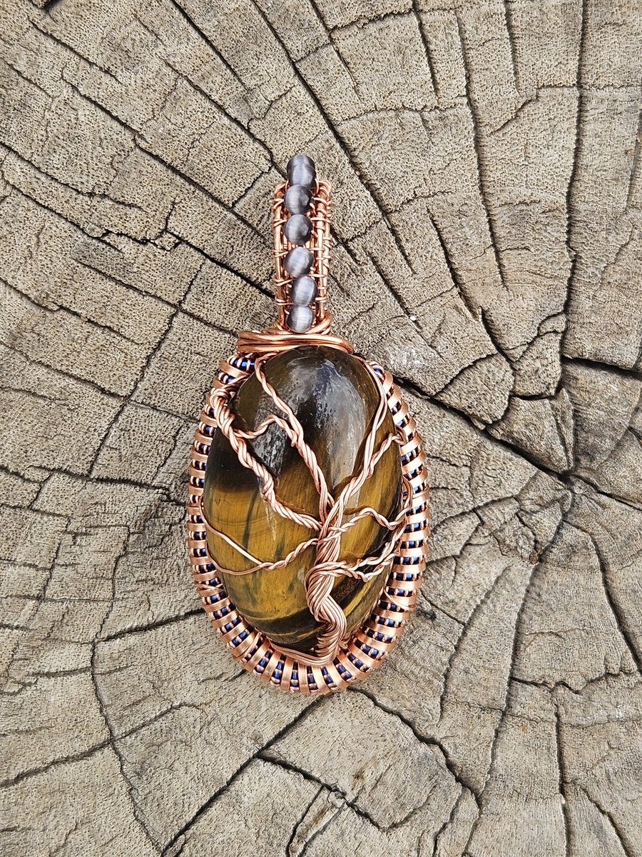 M7_Designs's tweet photo. Tigereye Stone:
Tree of Life Pendant with coil work and cat's eye beads in the bail.

Love it.

Avaliable 

Thanks for Viewing 

#treeoflife #neverstopwrapping #create #coilwork #consistency https://t.co/YCHsTkMe6F