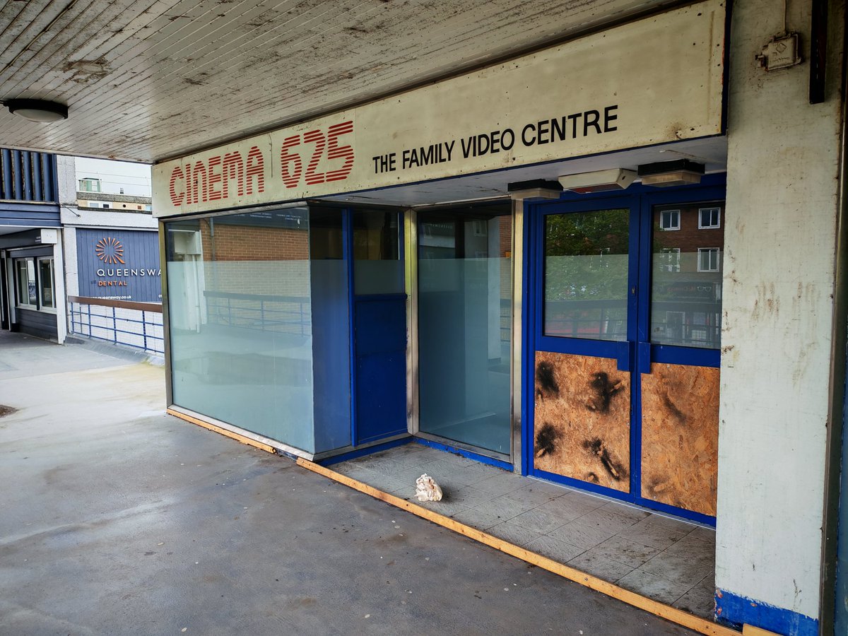 jamessimpson4u's tweet photo. It's been like this for years but my long closed local Blockbuster still has some branding up AND the sign from the prior video store it took over in 1991! I always marvel at it. https://t.co/ddQ9EuWGRt