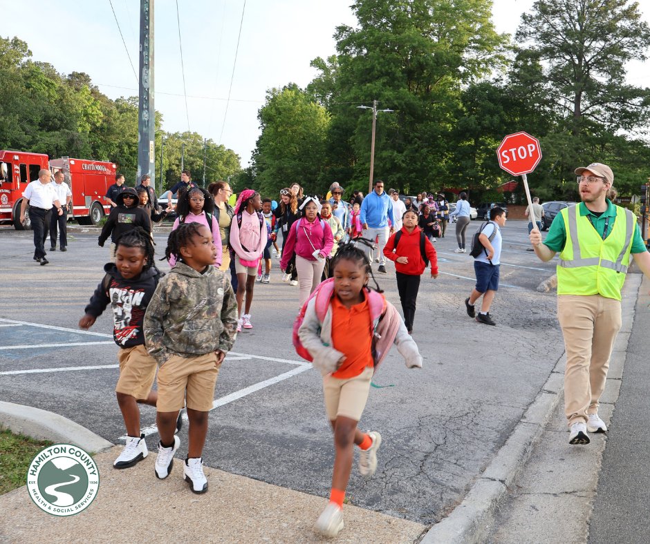 HamiltonHealth's tweet photo. Today is National Walk & Roll your Kids to School Day.  This morning, the Hamilton County Health Department joined the Woodmore Elementary students on their safe walk to school.  Walk-to-school events encourage physical activity, promoting safer routes for walking and biking, and building strong connections within our community.  In addition, these events raise awareness of pedestrian safety.  A special thanks to Woodmore Elementary faculty, Chattanooga Fire Department, Chattanooga Police Department, Children’s Hospital at Erlanger, and New Monumental Baptist Church for their role in making this a successful event. To learn more about these initiatives, please visit https://t.co/HtqwTDVUxc.
