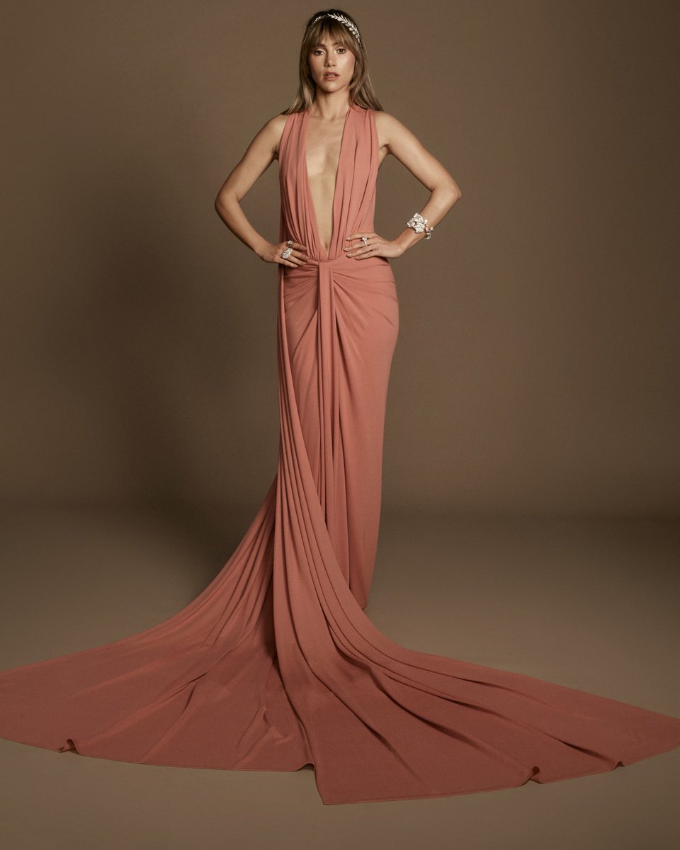 MichaelKors's tweet photo. “Suki Waterhouse is a multi-hyphenate, my favorite kind of woman—musician, actress, model, mother and muse. I wanted her look to nod to classic Greek drapery, seen in so many sculptures at the Met, but done through a 21st century lens so that it’s dramatic yet totally modern at the same time. Her jersey halter bodysuit and goddess skirt come to life in a beautiful shade of rose quartz pink inspired by the rose-tone marble sculptures in the collection.” -Michael Kors

Brand ambassador Suki Waterhouse in custom Michael Kors Collection for the 2026 Met Gala. 

#SukiWaterhouse
#MichaelKorsCollection
#MetGala