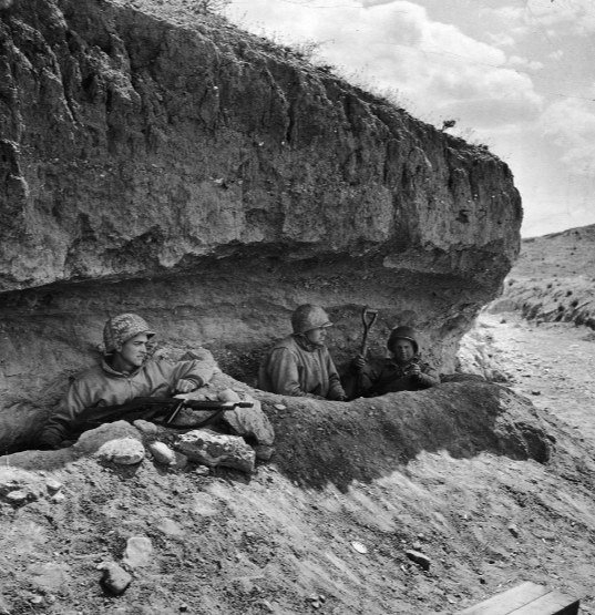 WW2Facts's tweet image. Three American tank-destroyer men in foxholes under a bank in Tunisia, 1943.

#History #WWII