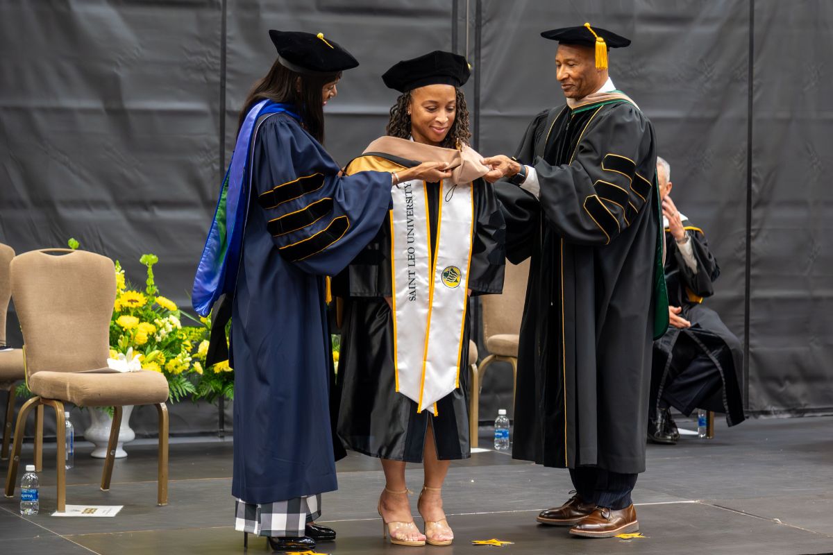 SaintLeoUniv's tweet photo. At today’s Doctoral Hooding Ceremony, graduates were formally recognized in the colors of their doctoral programs, marking the culmination of years of advanced study, research, and dedication. Congratulations to our newest Saint Leo doctors on this outstanding accomplishment. https://t.co/seQUCVg7eF