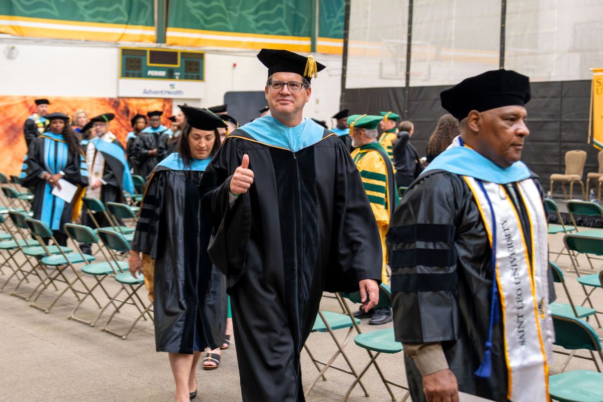 SaintLeoUniv's tweet photo. At today’s Doctoral Hooding Ceremony, graduates were formally recognized in the colors of their doctoral programs, marking the culmination of years of advanced study, research, and dedication. Congratulations to our newest Saint Leo doctors on this outstanding accomplishment. https://t.co/seQUCVg7eF