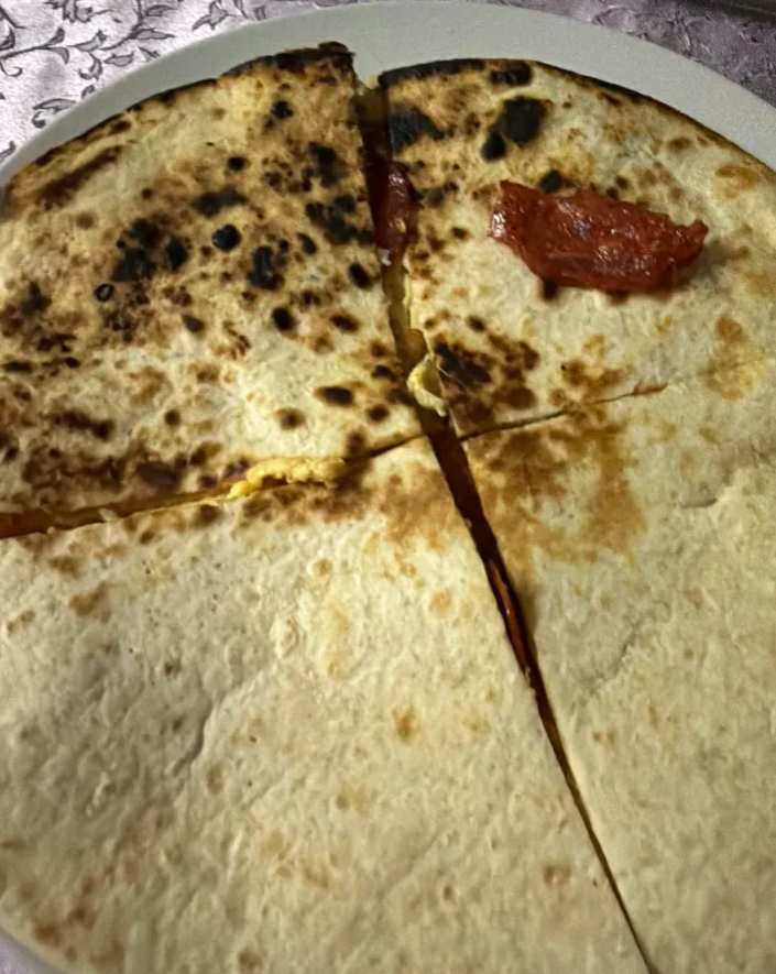 sprakeilous's tweet photo. i don't know what to tweet so here's my quesadila (rate my cooking skills) https://t.co/guMqgiPQV2