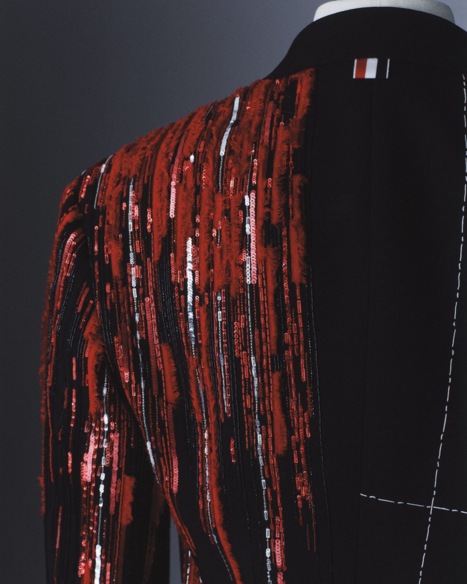 ThomBrowne's tweet photo. … cai xukun …
cai xukun wears custom thom browne for the 2026 met gala.

kun wears a cropped chesterfield jacket in black mohair, paired with a black wool lapel vest, trousers, elongated silk cummerbund and classic apron stitch boot in black calf leather. inspired by the body’s interior, one half of the look features over 400,000 dégradé overlapping sequins and bugle beads with frayed organza in shades of red representing the circulatory system, while the other half is rendered in hand-stitched tailoring thread interwoven with beaded lung and circulatory veins.  

the internal becomes the focal point as we look closer at the intricate life source within, the systems propelling us through daily life and into the world. 

#thombrowne #caixukun #kun #metgala