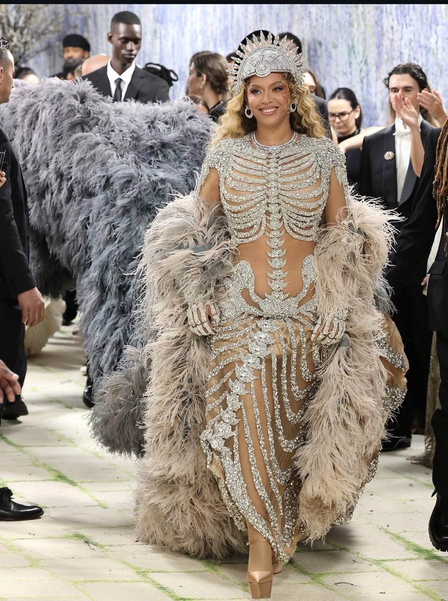 Beyoncé wore custom Amina Muaddi YIGIT pumps in latte satin at the MET GALA