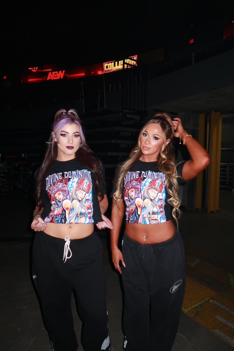 meganbayne's tweet image. Wanna look as DIVINE ✨ as your @aew women’s tag team champs? ShopAEW.com ,buy our shirt,  and #BOWDOWN

shopaew.com/en-us/products…

#DivineDominion 🖤🔥⚡️🪽