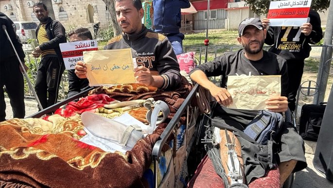 DropSiteNews's tweet photo. 🇵🇸 Dozens of wounded Palestinians and their families staged a sit-in Tuesday at Palestine Square in eastern Gaza City demanding permission to travel abroad for medical care amid Israeli-imposed crossing closures and delays in evacuating medical cases, according to the Palestinian Information Center.

As of May 2026, more than 20,000 patients are currently awaiting life-saving medical evacuation. While there is a standing commitment from Israel to allow 50 patients to leave daily, the actual rate has often dropped as low as 12 patients per day. 

Approximately 10 people on the evacuation list die every day while waiting for permission to cross. Since 2024, at least 1,268 patients have died while waiting for exit permits. At current evacuation speeds, it is estimated to take between 4.5 and 10 years to clear the existing list of critically ill patients.

The backlog includes roughly 4,000 cancer patients and thousands more with heart and kidney failure who cannot receive specialized care within Gaza. Over 4,500 children are also currently registered for urgent medical care abroad.

Participants carried banners declaring that medical treatment is “a right, not a favor” and displayed personal photos showing their conditions before and after their injuries to illustrate how treatment delays are preventing their recovery.

Source: Palestinian Information Center