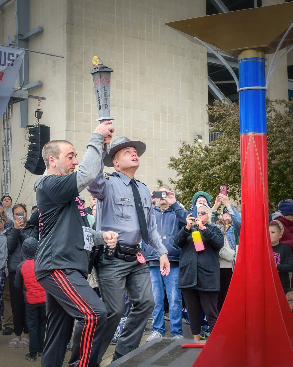 PAStatePolice's tweet photo. On April 26, the Paterno Family Beaver Stadium Run for Special Olympics Pennsylvania drew thousands of participants. Proceeds benefit athletes across PA. Troop G Community Services Officer Trooper Rhymestine helped carry the Flame of Hope and light the main cauldron. https://t.co/ytLoS16tr4