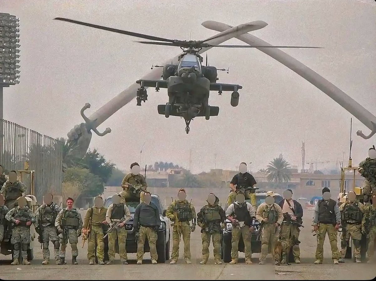 Members of the special military unit Task Force Black standing under ...