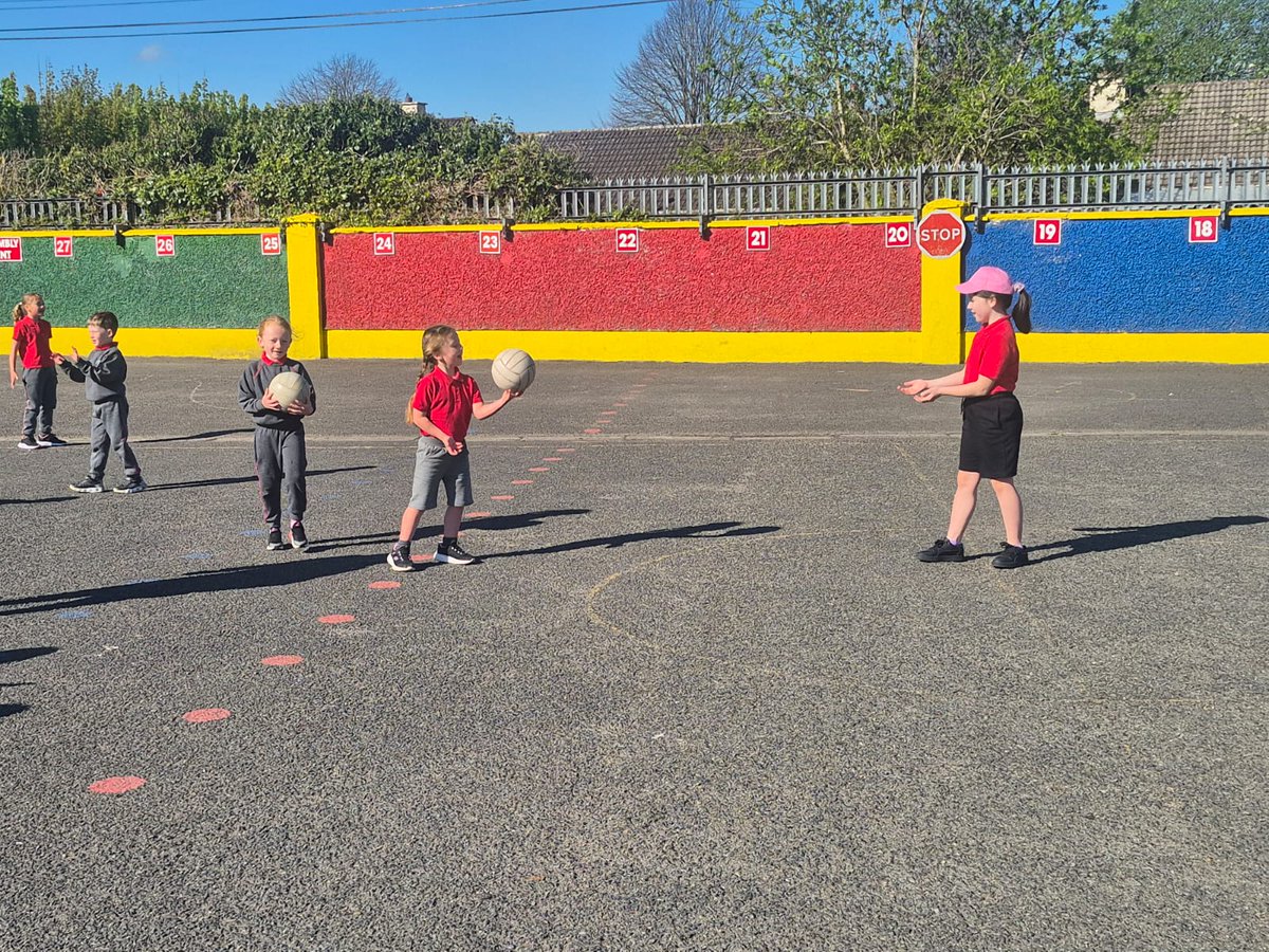st_navan's tweet photo. Fun in the sun...Ms Lynchs first pictured today on the middle yard practising their Gaelic football skills with Paul Codd from Meath GAA Coaching and Games. Paul has been working with classes from 1st to 4th the past 6 weeks. @MeathGAA https://t.co/QfTYul6NoI