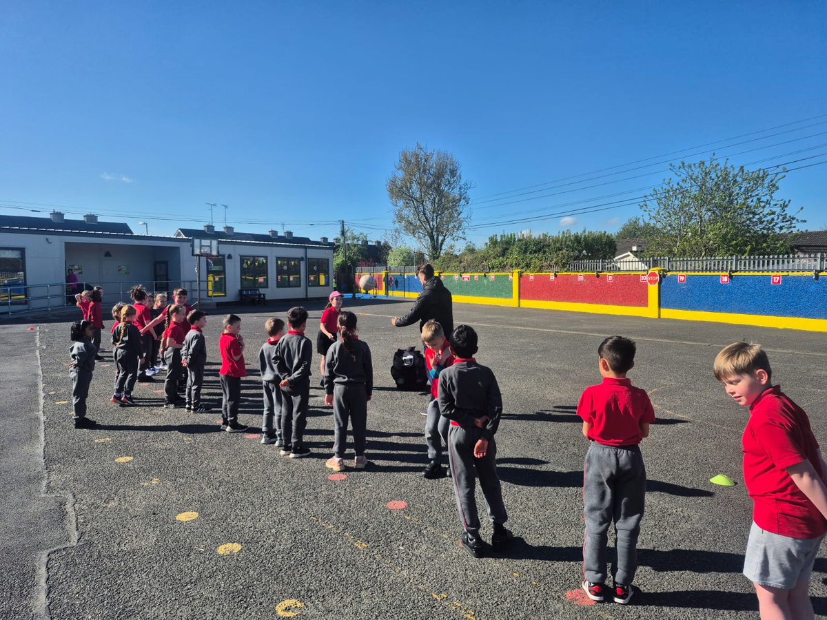 st_navan's tweet photo. Fun in the sun...Ms Lynchs first pictured today on the middle yard practising their Gaelic football skills with Paul Codd from Meath GAA Coaching and Games. Paul has been working with classes from 1st to 4th the past 6 weeks. @MeathGAA https://t.co/QfTYul6NoI