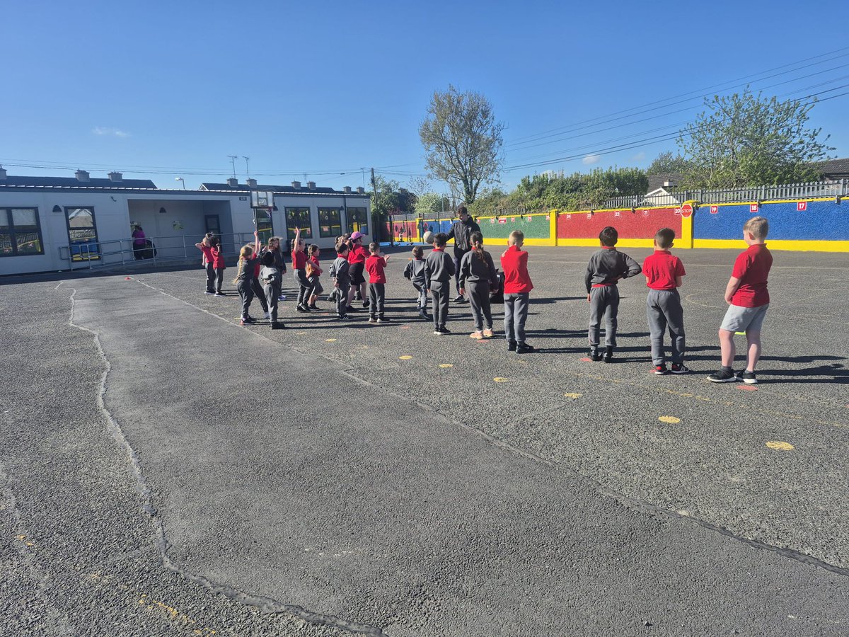 st_navan's tweet photo. Fun in the sun...Ms Lynchs first pictured today on the middle yard practising their Gaelic football skills with Paul Codd from Meath GAA Coaching and Games. Paul has been working with classes from 1st to 4th the past 6 weeks. @MeathGAA https://t.co/QfTYul6NoI