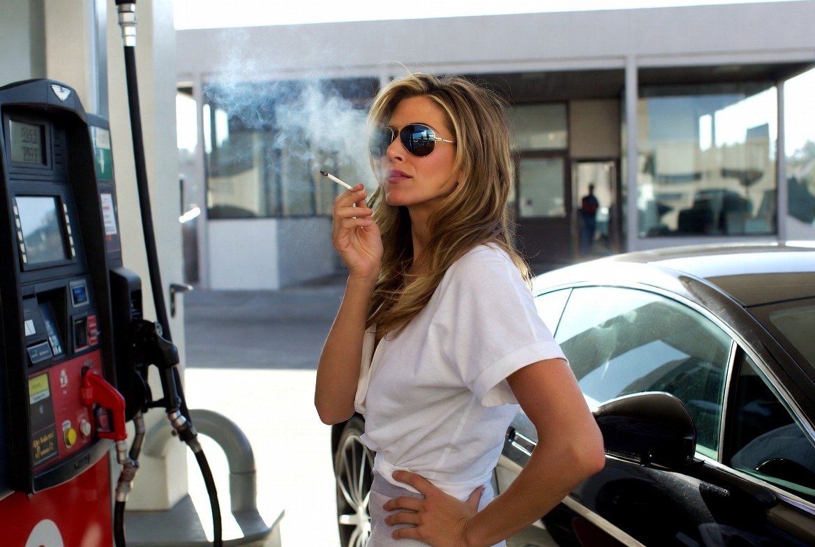 Jennwhatevertf's tweet photo. Gas prices spiked $0.40 yesterday.  Nothing says #winning like my Aston Martin sipping premium like champagne while my wallet files for emotional support. Thanks for the vibes, #MAGAmorons!

#smokefleet https://t.co/ZD3RN0HJoF