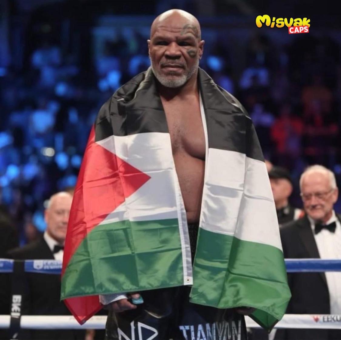 Mike Tyson, one of the world's top boxers, posed with a Palestinian flag 🇵🇸