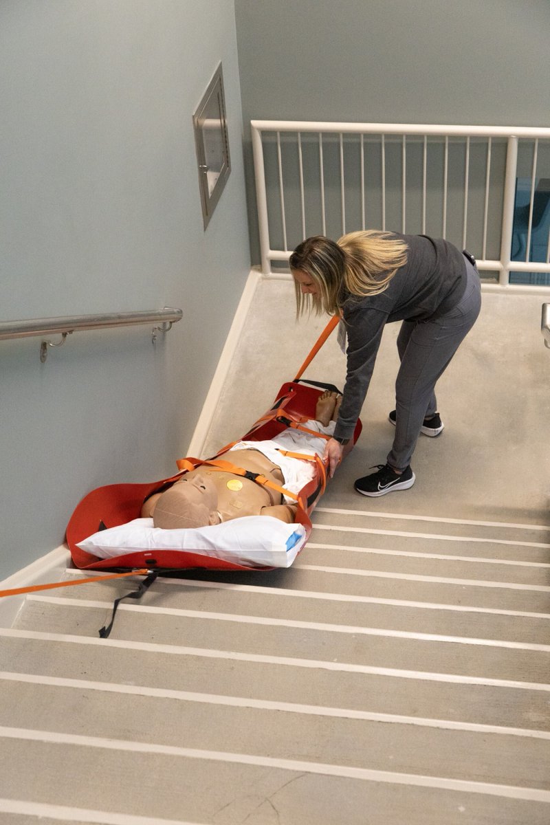 UNMC_iEXCEL's tweet photo. From patient room to stairwell, every part of the building can become a simulation space. Nebraska Medicine nurses recently trained for emergency evacuation scenarios, practicing how to safely and efficiently move ICU patients with a med sled! https://t.co/rE2p8OTEsa