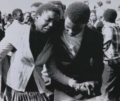 HistorySAZAR's tweet photo. A member of the deceased's family is led away from the grave side during a funeral for an unrest victim in Daveyton. August 8, 1985. Credit: Greg English/Reuters https://t.co/o0ZiFinTDe
