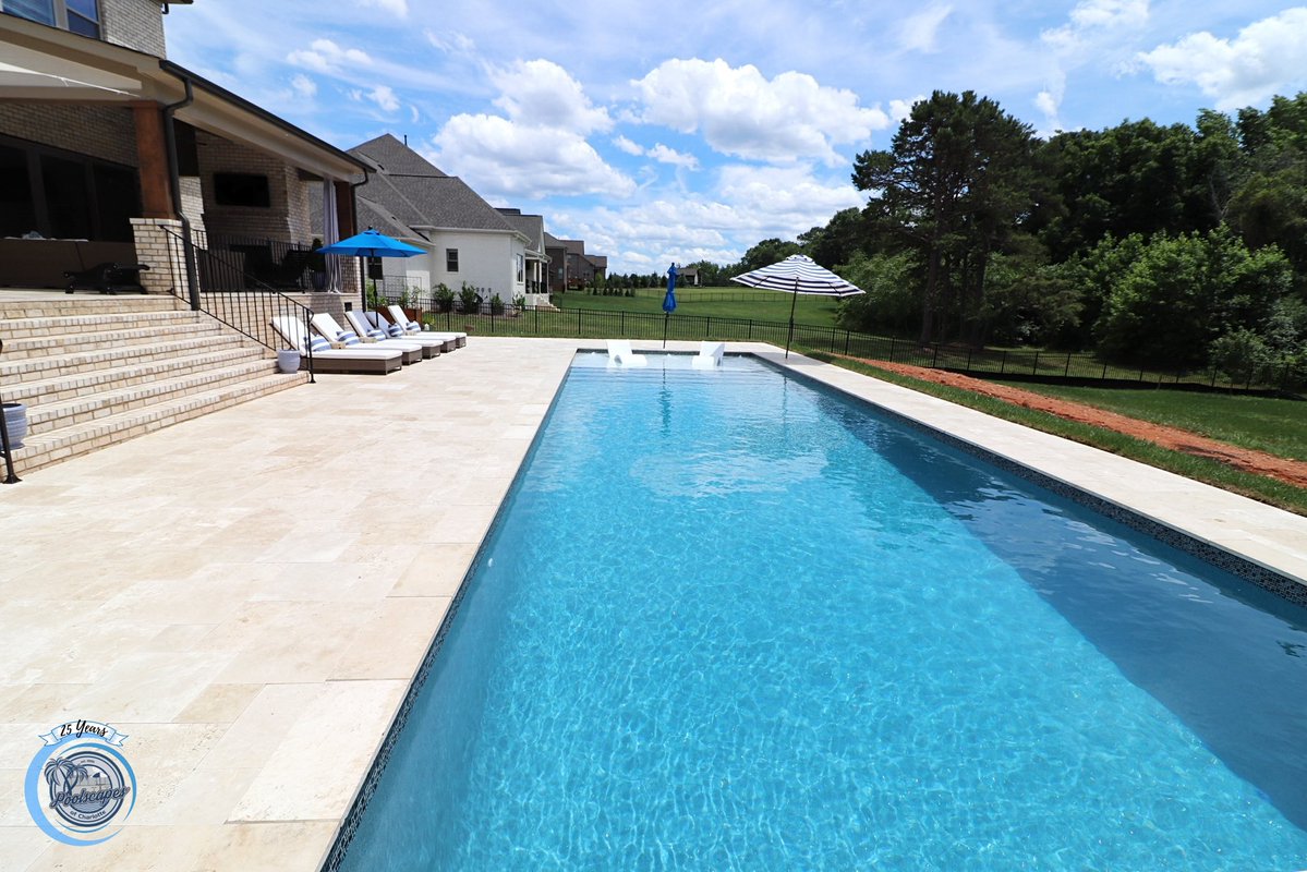 The 16’2” x 40’6” Oceanside #fiberglasspool model with a custom tanning ledge. The #pool featured is in the color Granite.  #backyardpool