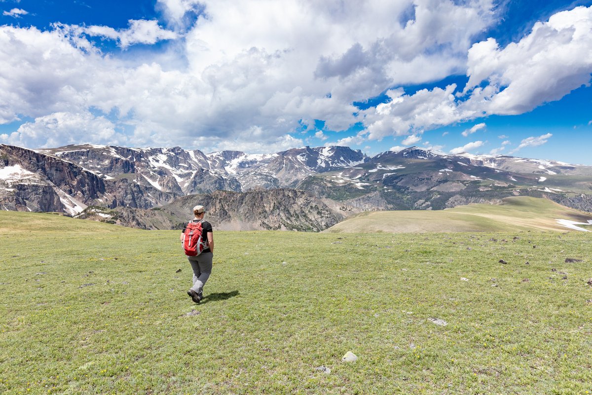 YellowstoneNPS's tweet photo. Being the first national park, we often hog the spotlight. So, we wanted to highlight our friends at surrounding parks, forests, wildlife refuges, and more!

Here's just a very small sample of the beauty and history you can experience outside of the park boundary. Have you visited a nearby area that inspired you?

If you're looking for ideas of nearby areas to visit, our website is a great place to start: https://t.co/7nSdR5Te1T

Photos: (1) Hiking in Custer-Gallatin National Forest near the Beartooth Highway (road is tentatively scheduled to open May 22); (2) Hiking into a lava tube cave at Craters of the Moon National Monument and Preserve; (3) Mountain views at Grand Teton National Park; (4) Rainbow at Bear Paw Battlefield at Nez Perce National Historical Park.