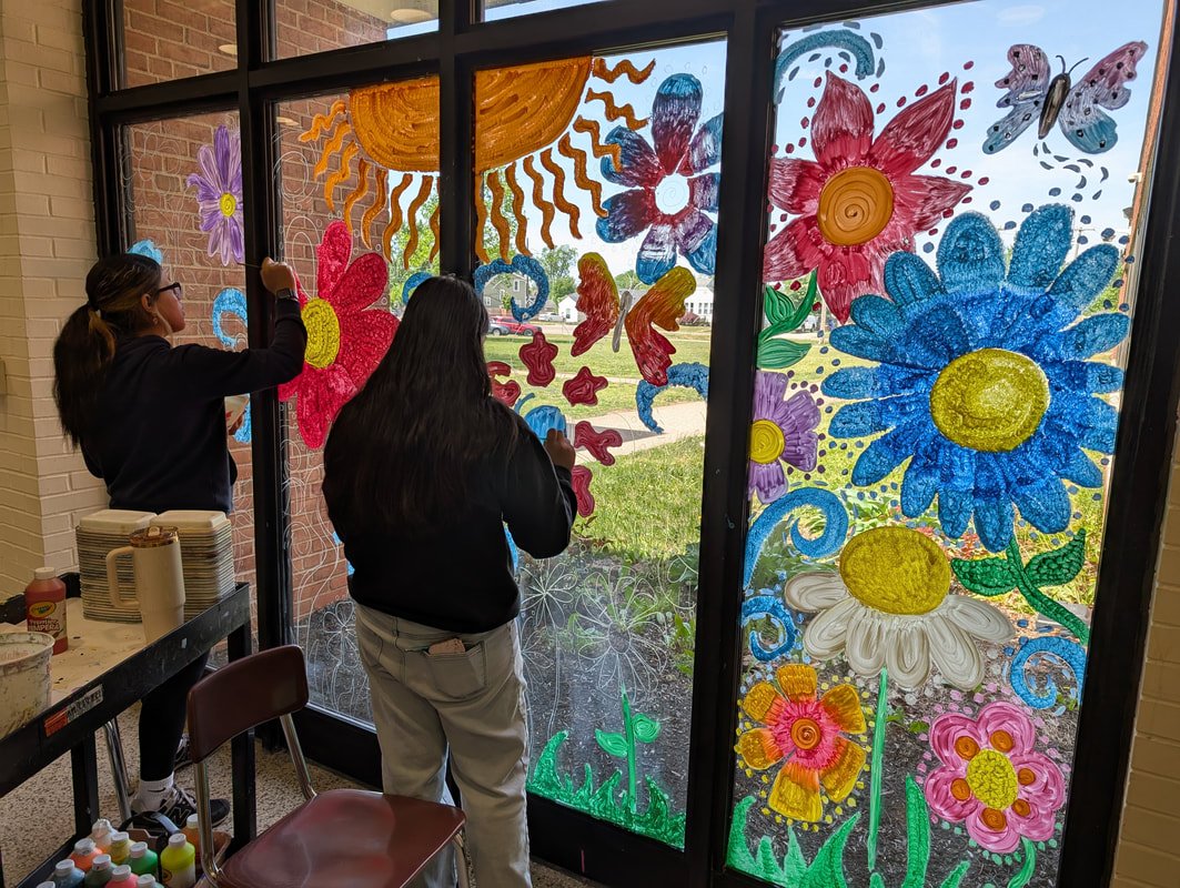 Hamilton_CSD's tweet photo. Ms Frey's Art 1 students painted Window Murals throughout Garfield MS, over the past month.  Students worked collaboratively to produce murals that shined throughout the entire building. This was a first for most students in the realm of murals and material expression. https://t.co/6U1qzFaFQM