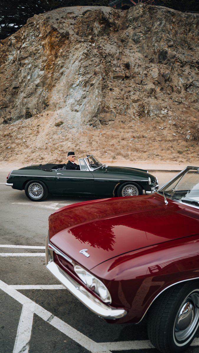 Official_DGD's tweet photo. Caught in the rearview, a deep red beauty and a suave green convertible - memories from last year's sun-drenched San Francisco drive. 

📸 Cosmin Colan @_cosmincolan  
🌎 San Francisco, California https://t.co/Q4sAE9QQ5W