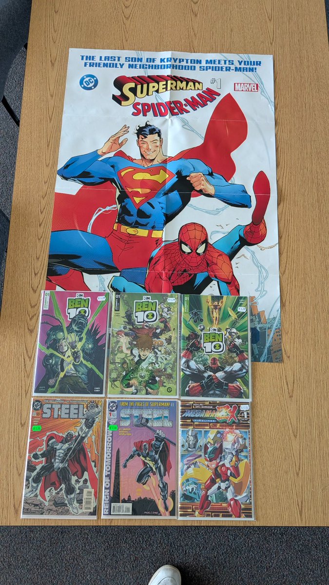 AJPrice803's tweet photo. Happy #Ben10 release day. First time ever participating in new comic book day and had quite a time during lunch break and even got a free Spidey/Supes poster for my classroom https://t.co/DxNNSeyIDM