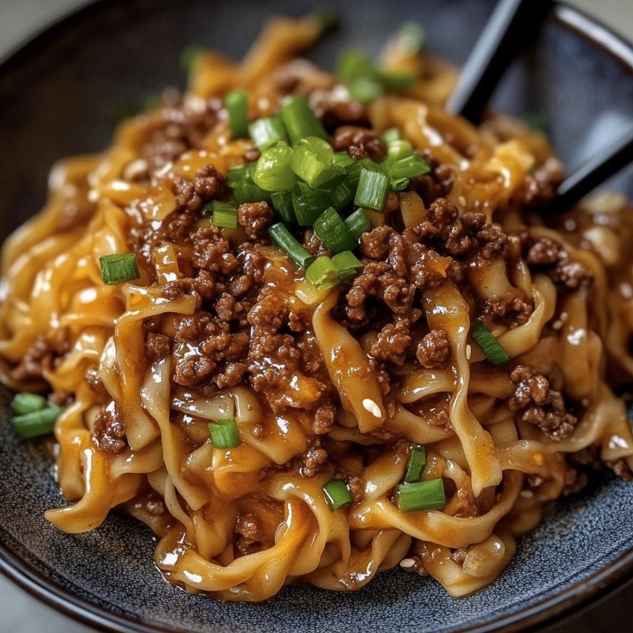 summer_food's tweet photo. Mongolian Ground Beef Noodles

Ingredients:

1 lb ground beef
5 cloves garlic, minced
⅓ cup brown sugar
¼ cup beef broth
⅓ cup soy sauce
3 tablespoons hoisin sauce
½ teaspoon ground ginger
½ teaspoon ground black pepper
Pinch of red pepper flakes (optional for a spicy kick)
10 oz linguine
1 tablespoon cornstarch
2 tablespoons water
4 green onions, sliced for garnish
Directions:

Cook the Pasta:

Cook the linguine according to the package instructions in a large pot of boiling water. Drain and set aside.
Brown the Ground Beef:

In a large skillet over medium-high heat, brown the ground beef until no longer pink. Drain any excess fat.
Add Aromatics and Sauces:

Add minced garlic to the skillet with the beef and cook for about 1 minute until fragrant.
Pour in soy sauce, beef broth, brown sugar, hoisin sauce, ground ginger, black pepper, and red pepper flakes (if using). Stir well to combine.
Thicken the Sauce:

In a small bowl, mix cornstarch with cold water until smooth. Stir this mixture into the skillet with the beef and sauce.
Allow to simmer gently until the sauce thickens to your desired consistency.
Combine with Noodles:

Add the cooked linguine to the skillet with the beef and sauce. Toss together until the noodles are fully coated with the sauce.
Let them simmer together for a few minutes to absorb the flavors.
Garnish and Serve:

Sprinkle sliced green onions over the noodles.
Serve hot and enjoy your Mongolian Ground Beef Noodles!