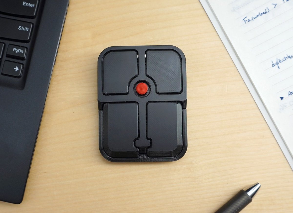 Open-source hardware HID device with four programmable buttons and a ...