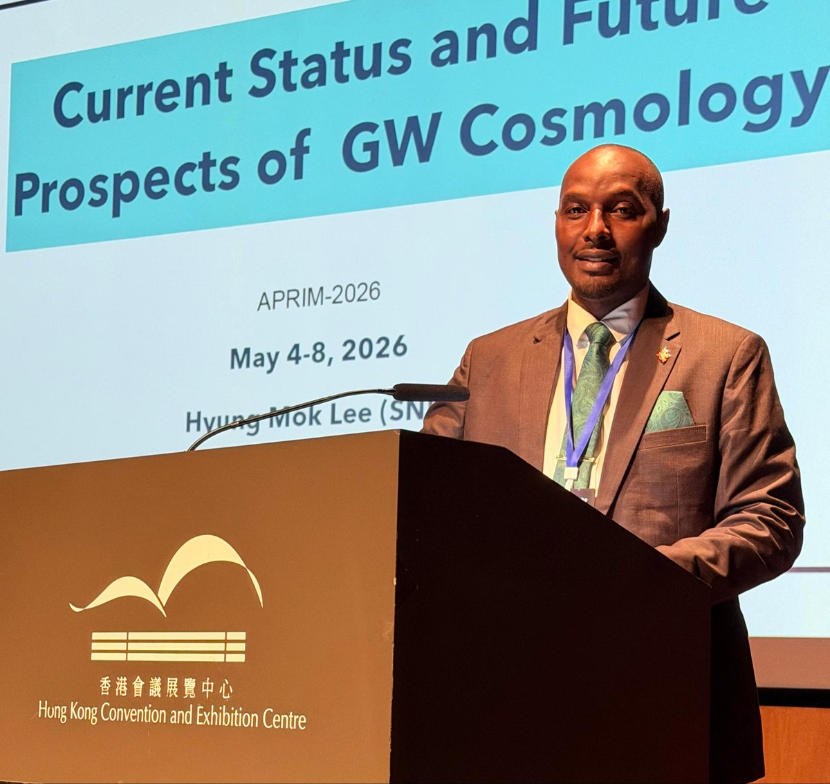 EngJonard's tweet photo. “When the universe speaks in curvature, only spacetime itself becomes the messenger.”

At #APRIM2026, in Current Status & Future Prospects of GW Cosmology presented by Eng. Jonard Asiimwe & Prof. Martha Margarita López Gutiérrez (Korea Institute for Advanced Study, South Korea), the frontier of cosmology is being redefined through gravitational-wave science.

Since the first detection in 2015, over 100 confirmed gravitational-wave events have been recorded, revealing black hole & neutron star mergers & opening a new observational window beyond electromagnetic astronomy. GW cosmology now probes Hubble expansion, dark energy constraints, & early-universe structure formation, with next-generation detectors expected to improve sensitivity by up to 10×, reaching deeper cosmic epochs.

“In every ripple of spacetime, the universe encodes both origin & destiny.” This insight connects detection physics with cosmological evolution, where gravitational waves become direct tracers of cosmic history.

Africa is part of this expanding scientific horizon through growing engagement in astrophysics, data science, and space technology collaboration positioning the continent within the global gravitational-wave research ecosystem.