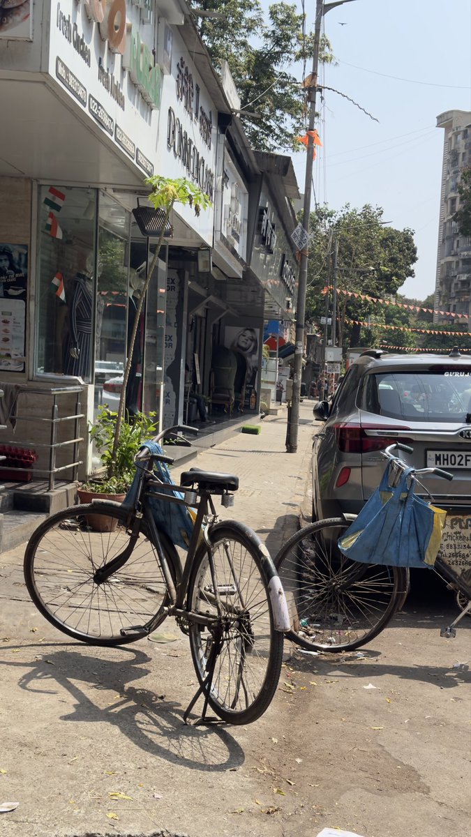 RRanshinge's tweet photo. @mybmc kw ward Lokhandwala Vyapari mandal &amp; shopkeeper-who park their cycle and motorcycle taking the road space along with all the ACs facing on the footpath with the hot air. How do a citizen walk? https://t.co/EcpkrEt9XX