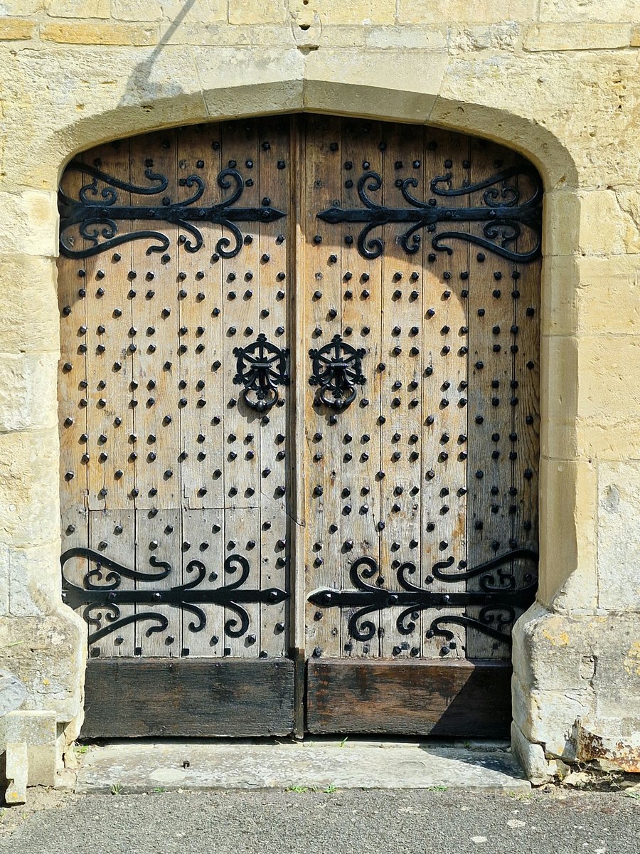 StroudStory's tweet photo. An #AdoorableThursday door from Charlton Kings, #Gloucestershire with an enviable number of studs and curclicues making it a contender for #IronworkThursday, too. This is the south porch - shut. But the west door is always open! https://t.co/sLQLsyIiU1