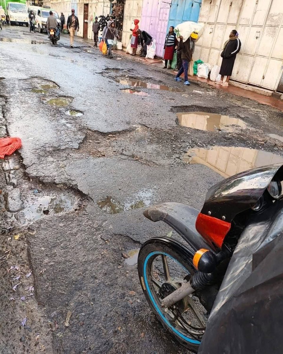 Geff_GMwangi's tweet photo. A 'Two-Term' slogan won’t fill a pothole. Nakuru CBD roads are unpassable, and the people have officially taken over the Ministry of Transport. 

It is a disgrace that we pay taxes only to provide our own labor. Governor, stop waving and start working. The people of Nakuru are tired. #NakuruDeservesBetter #TujengeUpya
#thenakuruwewant #RoadsNotWaves