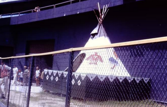 Jimfrombaseball's tweet photo. "In 1982, when the Atlanta Braves opened the season with 13 wins, owner Ted Turner
removed Chief Noc-A-Homa's Teepee to sell more seats.
The Braves promptly lost 19 of their next 21 games, and fell to second place.
Ted Turner told team management to put Chief Noc-A-Homa's Teepee back up and the Braves went on to win the National League West.
"The general public was saying it was because we took the tepee down that we lost.
There were people who came to the stadium wearing tepees on top of their head, and it was the general public’s outcry that finally caused Ted Turner to put the tepee back up."
Levi Walker.
Chief Noc-A-Homa was making $60 per week!!
From 1969 to 1985, Levi Walker played the role of the Atlanta Braves legendary mascot.
"For years, I averaged 240 days per year visiting schools, hospitals and children who were struggling with health issues.
That was the best part to encourage some of these children going through difficult times and see their smiling faces."